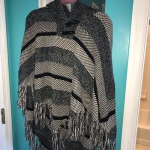 Black, white, and gray poncho